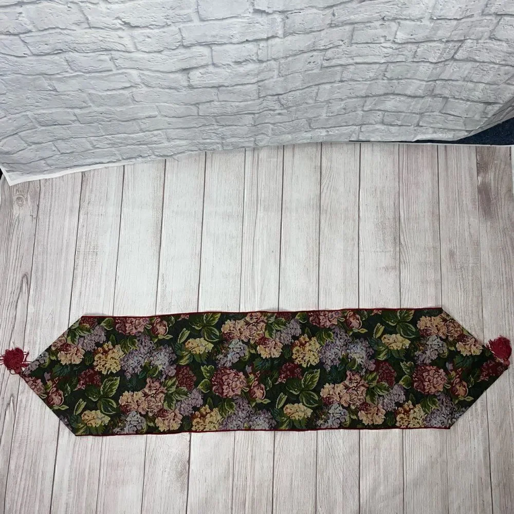 Floral print table runner with fringe ends approx  52”x12.5”